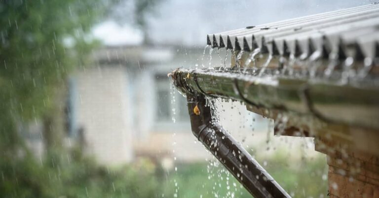 Water overflowing a gutter due to heavy rain | ATI Restoration