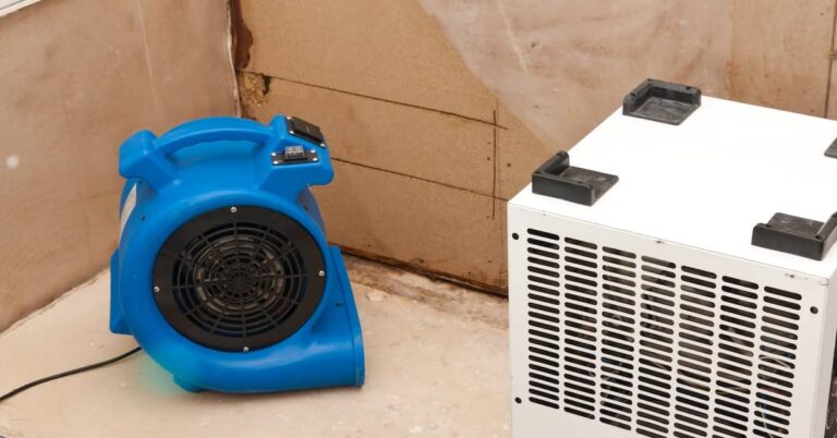 Dehumidifier and fan set up for water damage restoration process | ATI Restoration